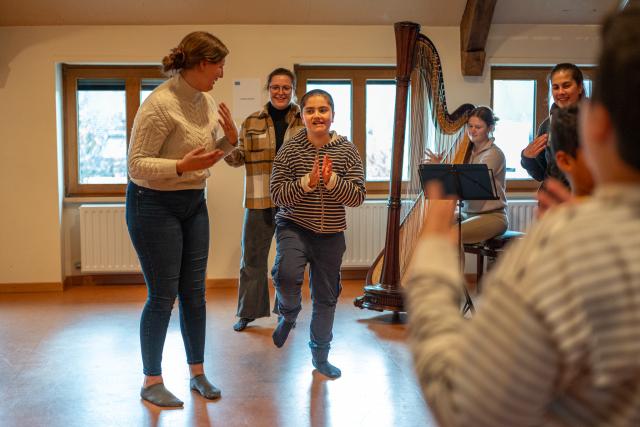 Autistic child dances to harp music