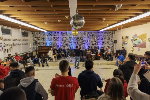 a concert in a refugee hostel