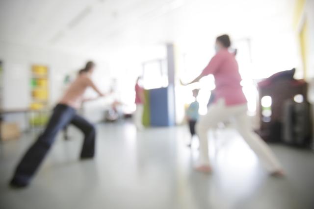 Very blurred photo of a dance workshop in a child psychiatry clinic
