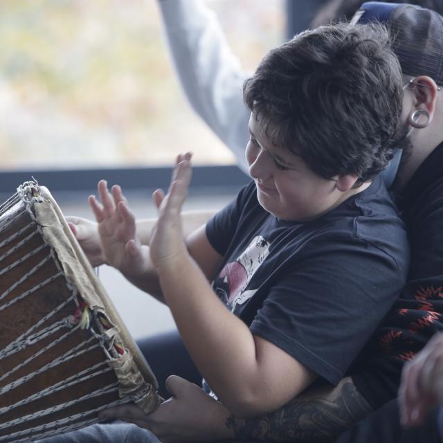 Child playing djembe